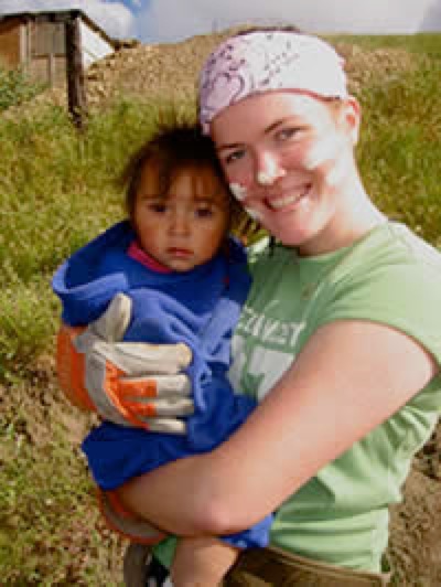 Volunteer holding a child
